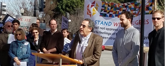 Lenny stands with refugees